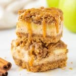 two caramel apple cheesecake bars stacked on each other