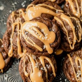 a pile of double chocolate caramel cookies with sea salt