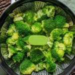 steamed broccoli in a steamer basket
