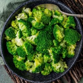 overhead view of a bowl of steamed broccoli