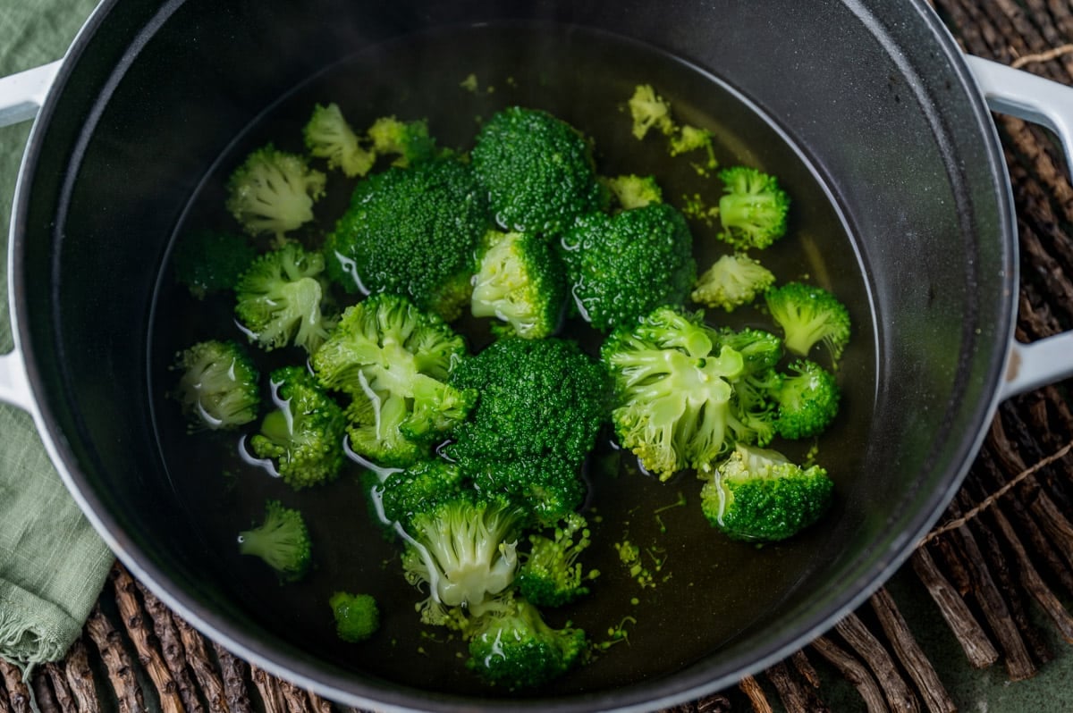 steamed broccoli in a pan with water