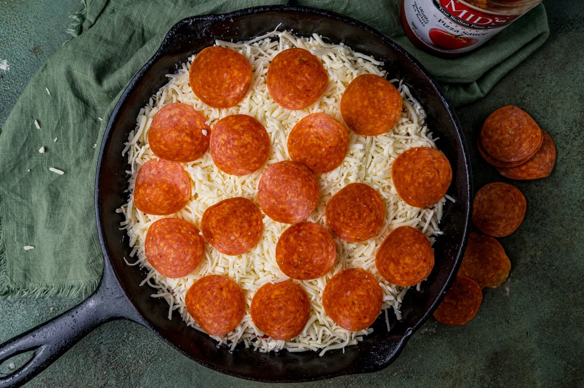 unbaked pepperoni mozzarella dip in a skillet