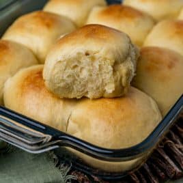 pudding dinner rolls in a baking pan