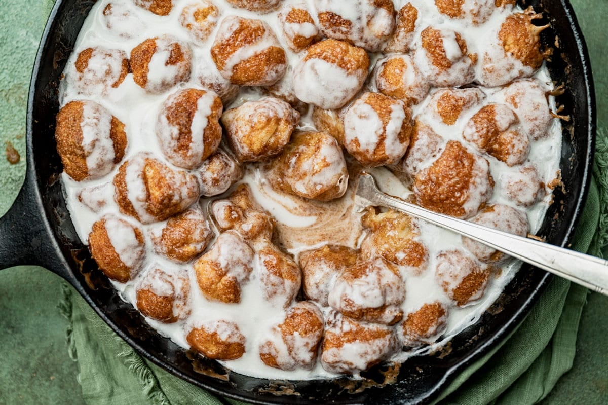 cinnamon roll bites in a skillet