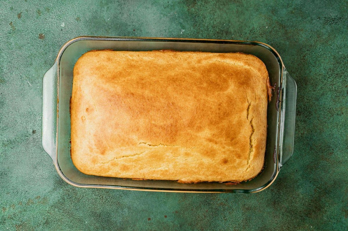 sour cream cornbread in a glass baking pan