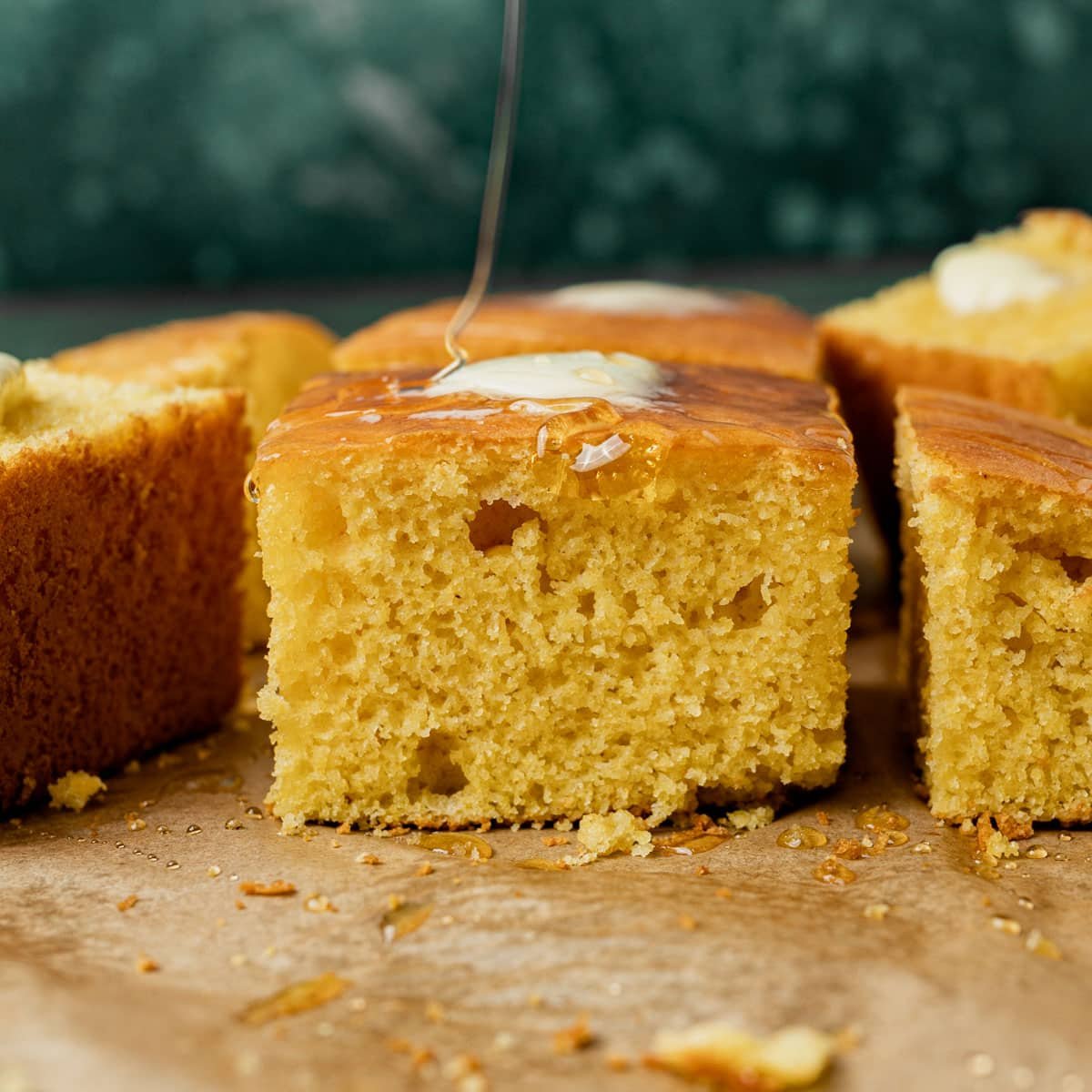 honey drizzling on sour cream cornbread