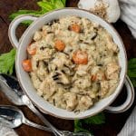 an overhead view of a bowl of creamy chicken & wild rice soup