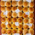 dinner rolls with different bread washes on them