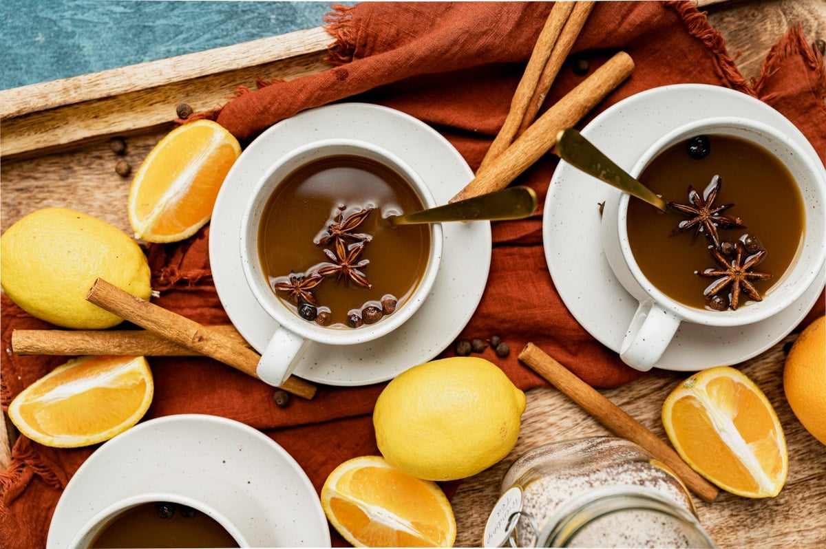 two mugs of friendship tea with orange slices