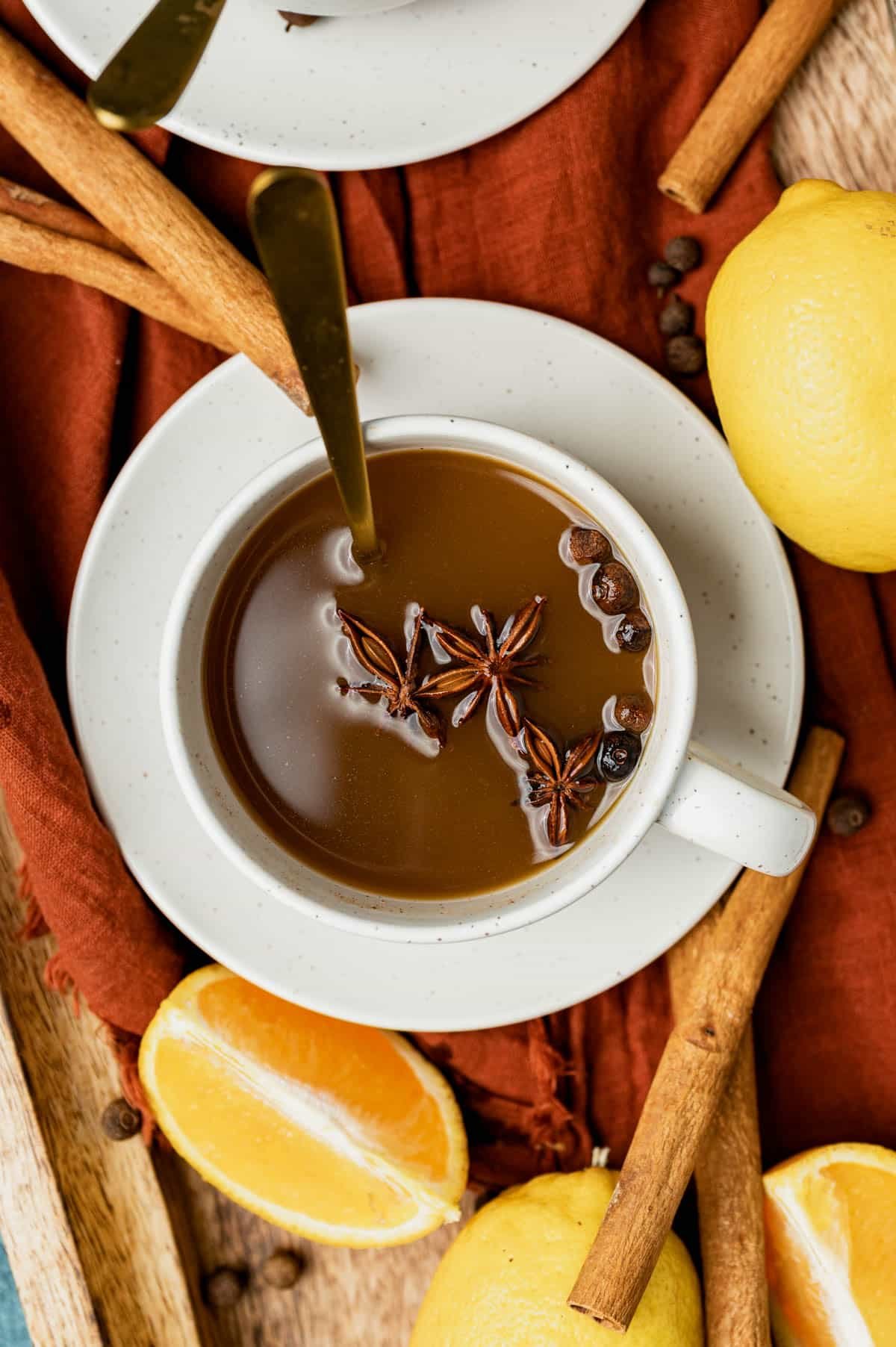 overhead view of a cup of friendship tea with anise and cloves