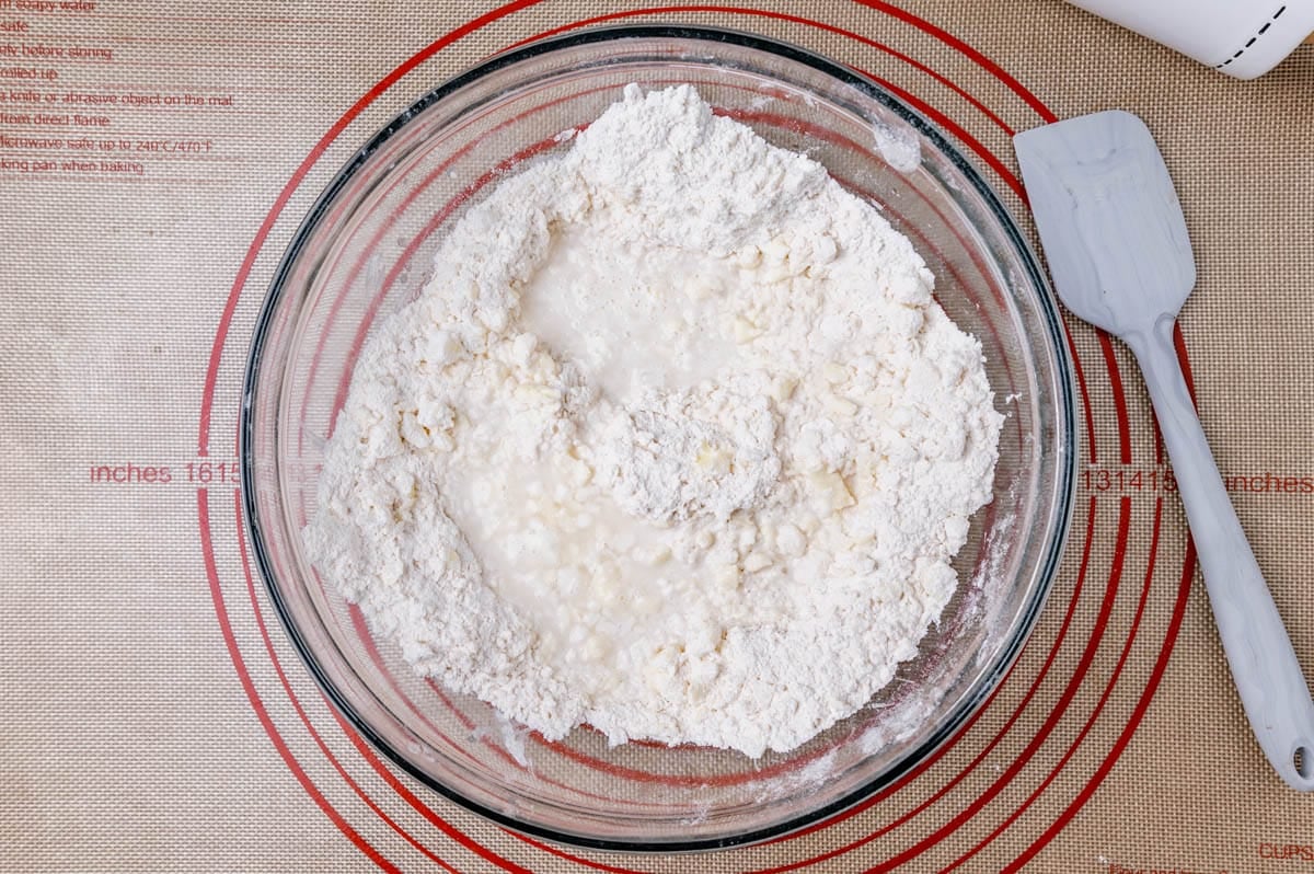 flour in a mixing bowl with water poured over top