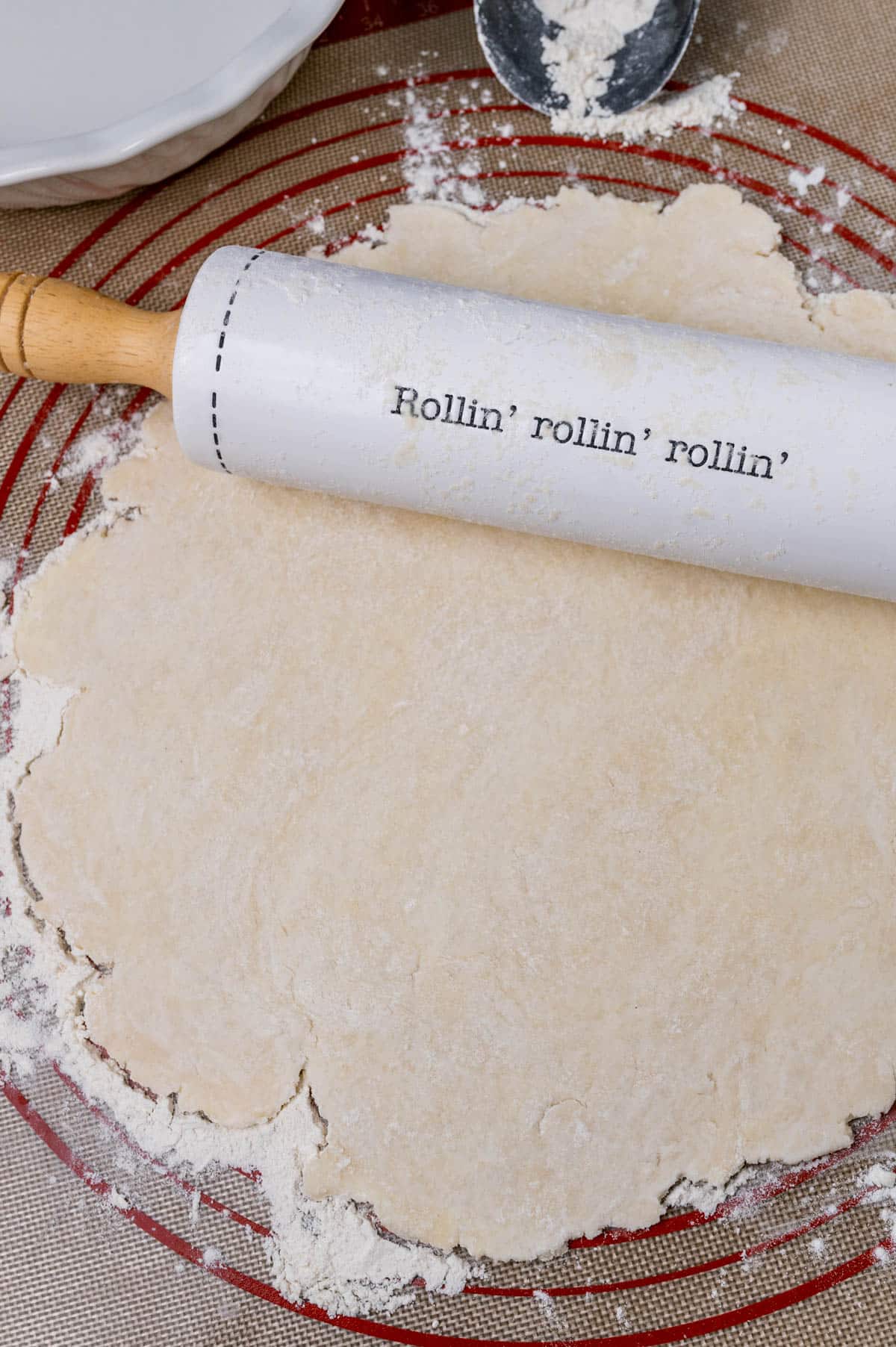 rolling sitting on top of a rolled out pie dough