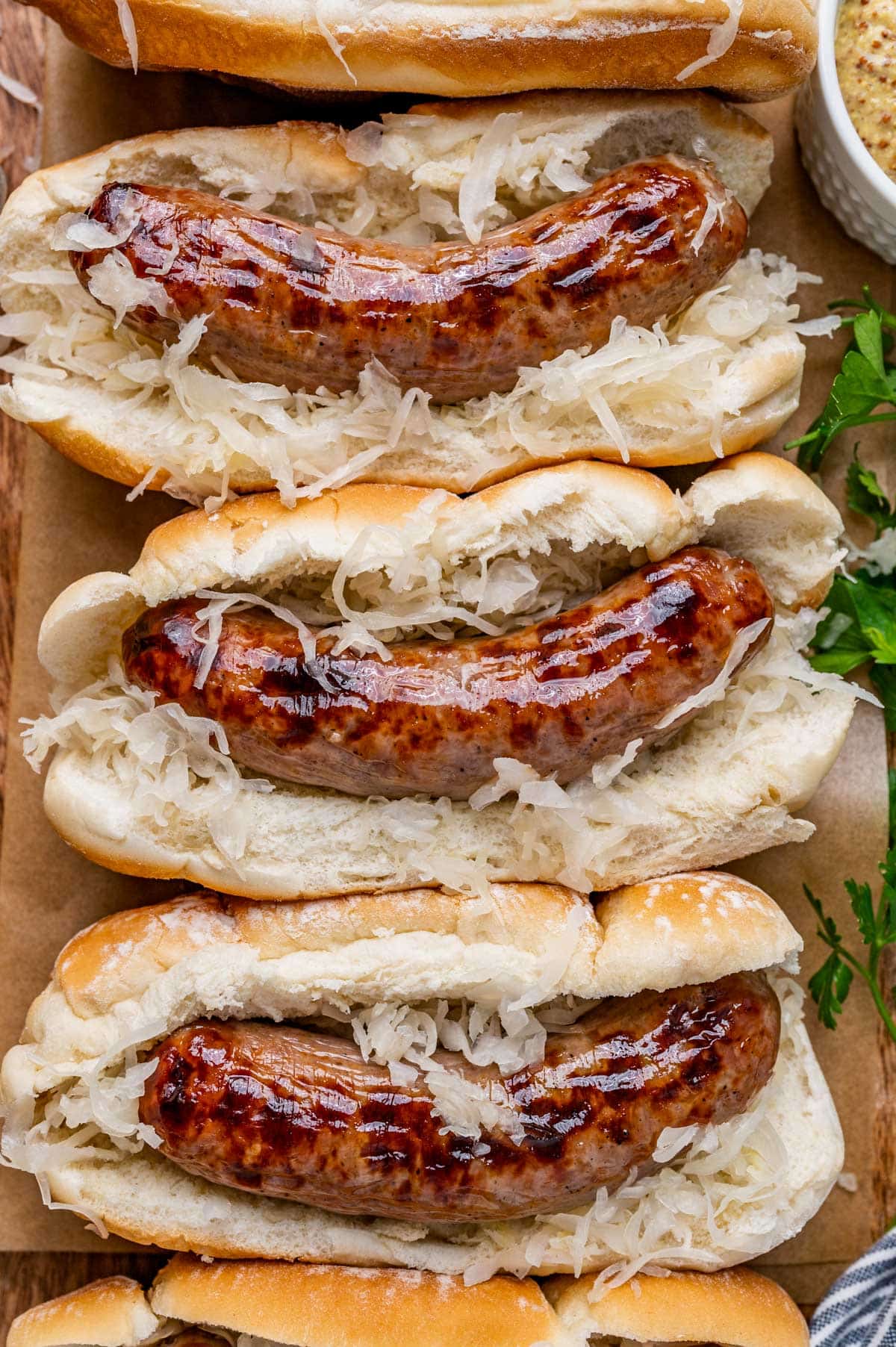 overhead view of sauerkraut and bratwurst sandwiches