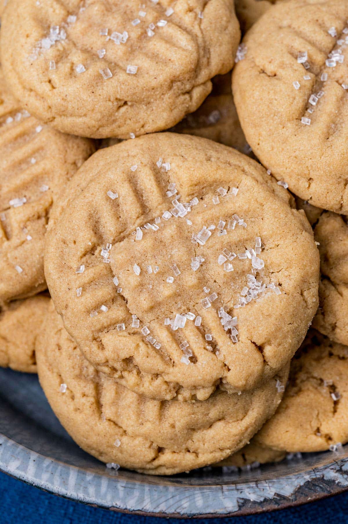 peanut butter cookies in a tray with coarse sugar on top