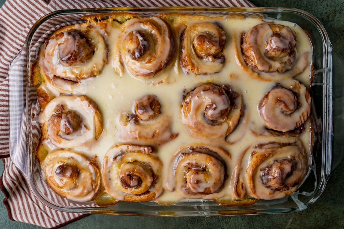 overhead view of glazed orange cinnamon rolls