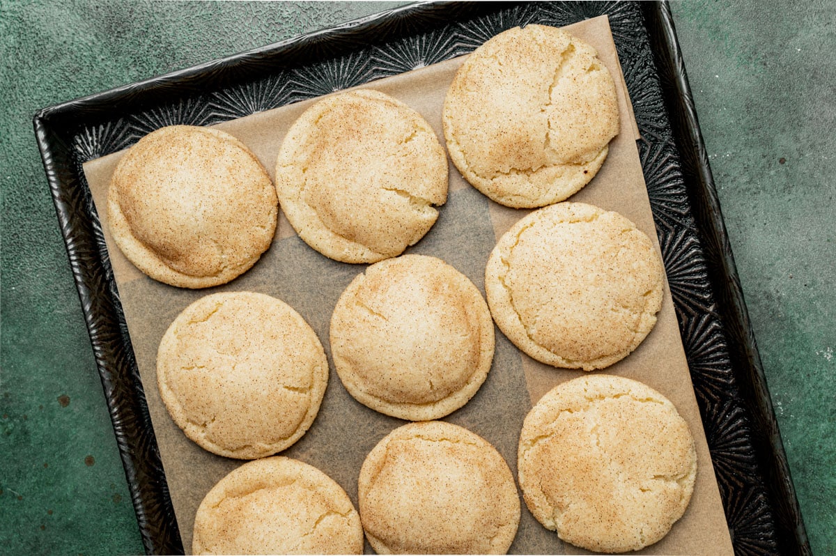 overhead view of snickerdoodle cookies on a baking sheet