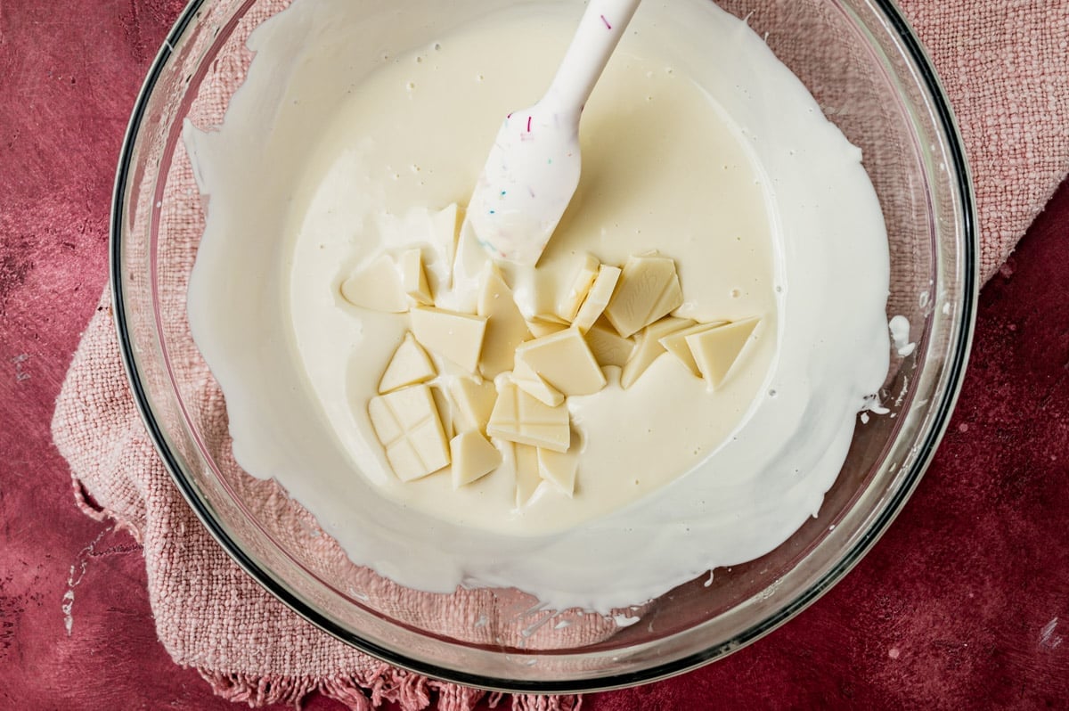 melting white chocolate in a glass bowl