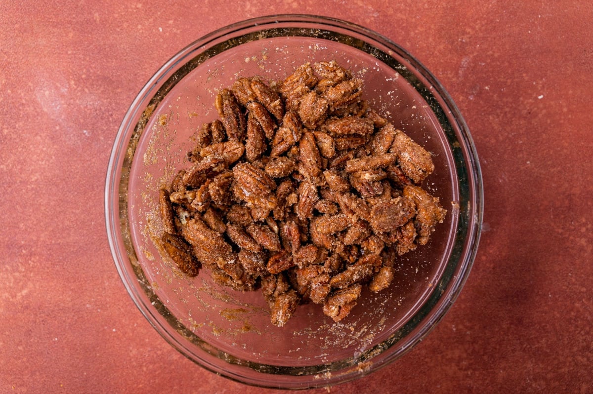 sugar coated pecans in a glass bowl