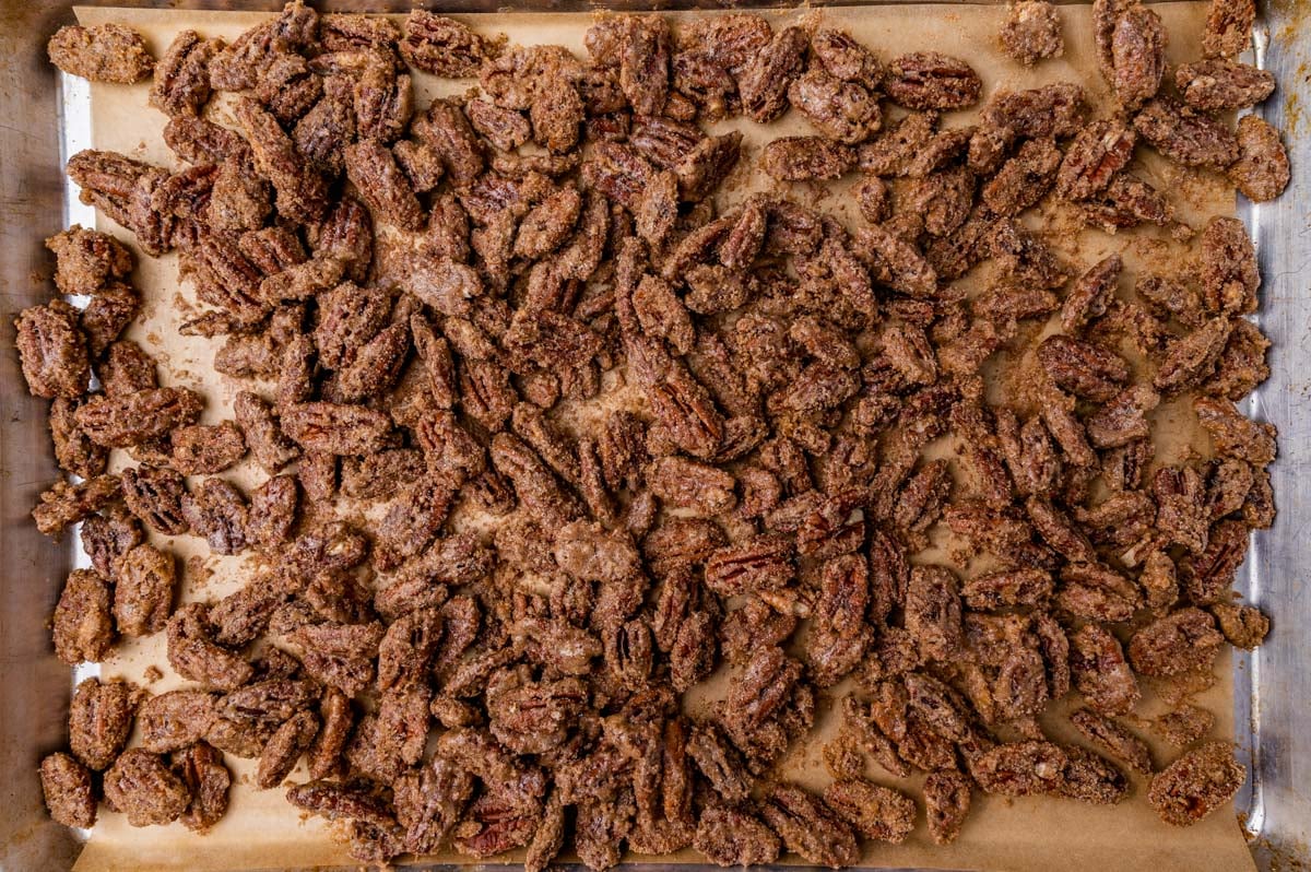 candied pecans on a baking sheet