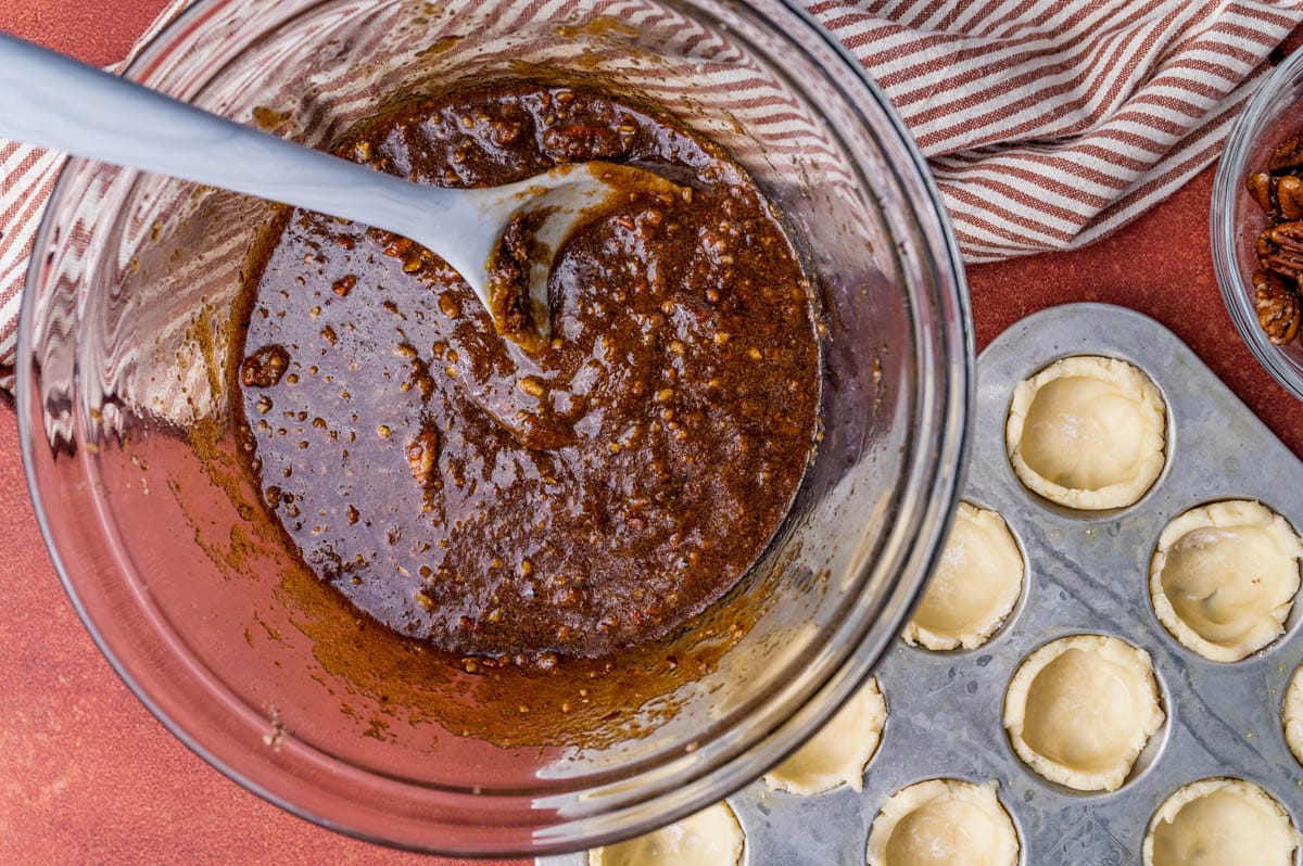 filling for pecan tassies in a glass bowl