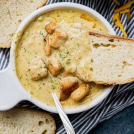 overhead view of a bowl of broccoli cheddar soup