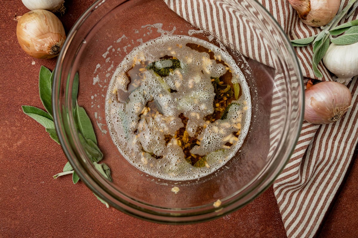 sage butter sauce in a black bowl