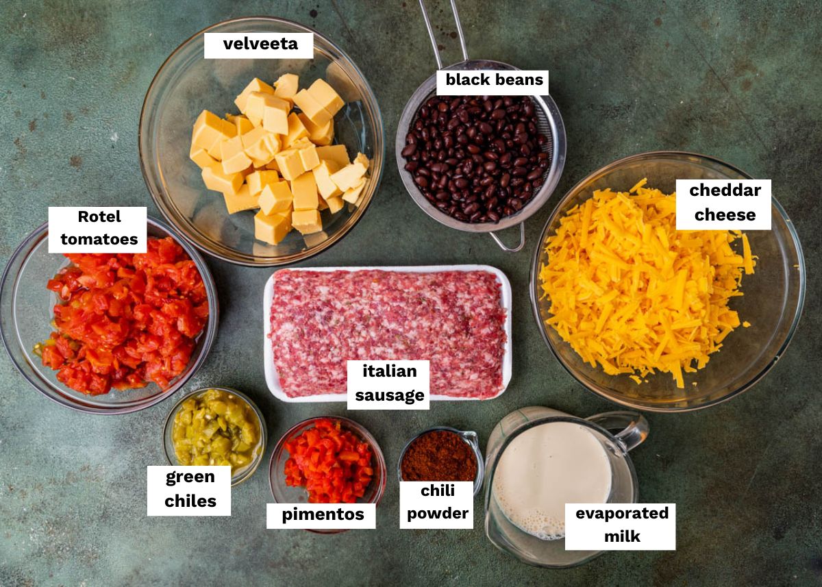 ingredients for cheesy sausage dip sitting on a table