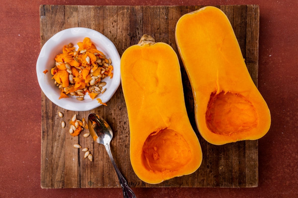 butternut squash cut in half with the seeds scooped out