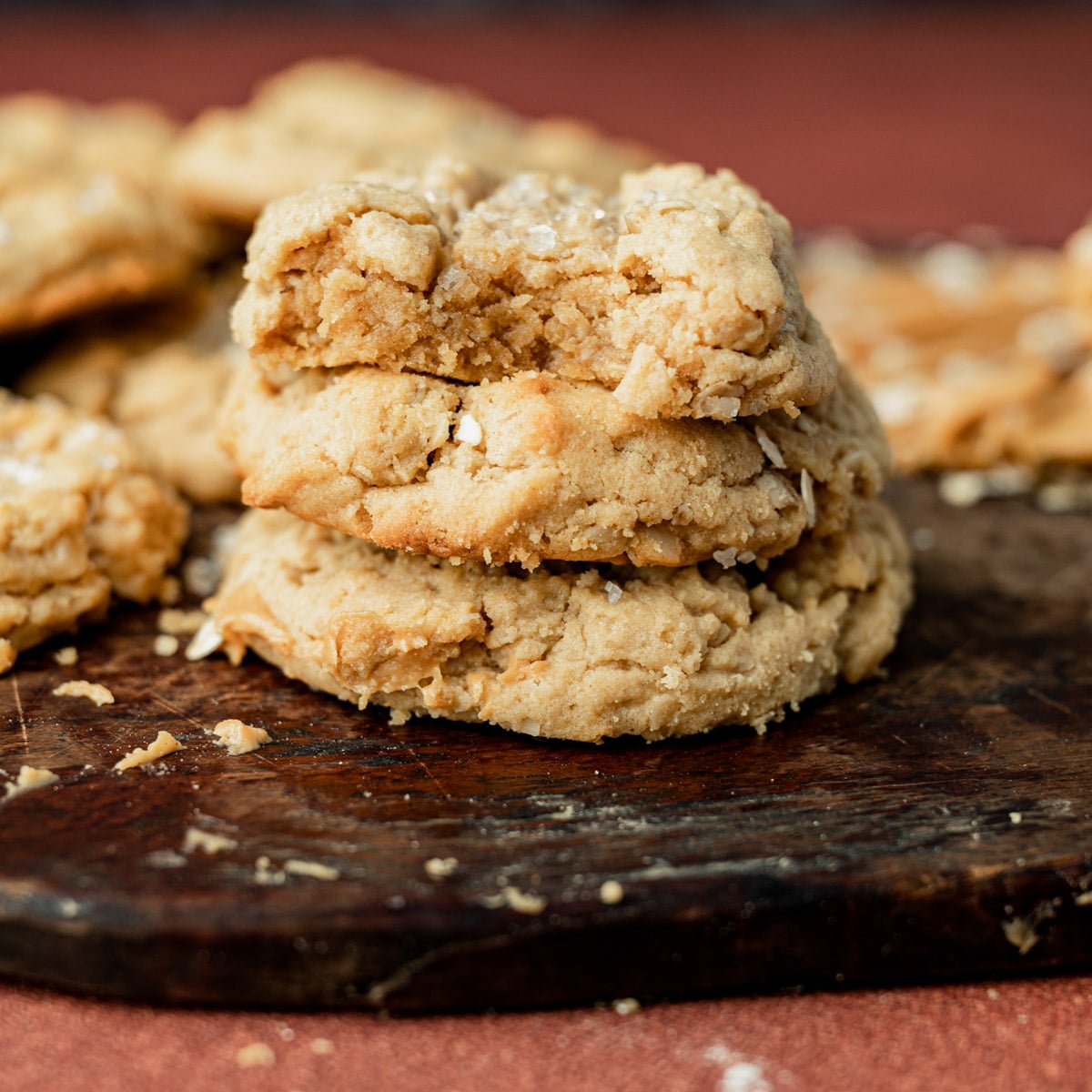 a stack of 3 peanut butter oatmeal cookies, one with a bite out