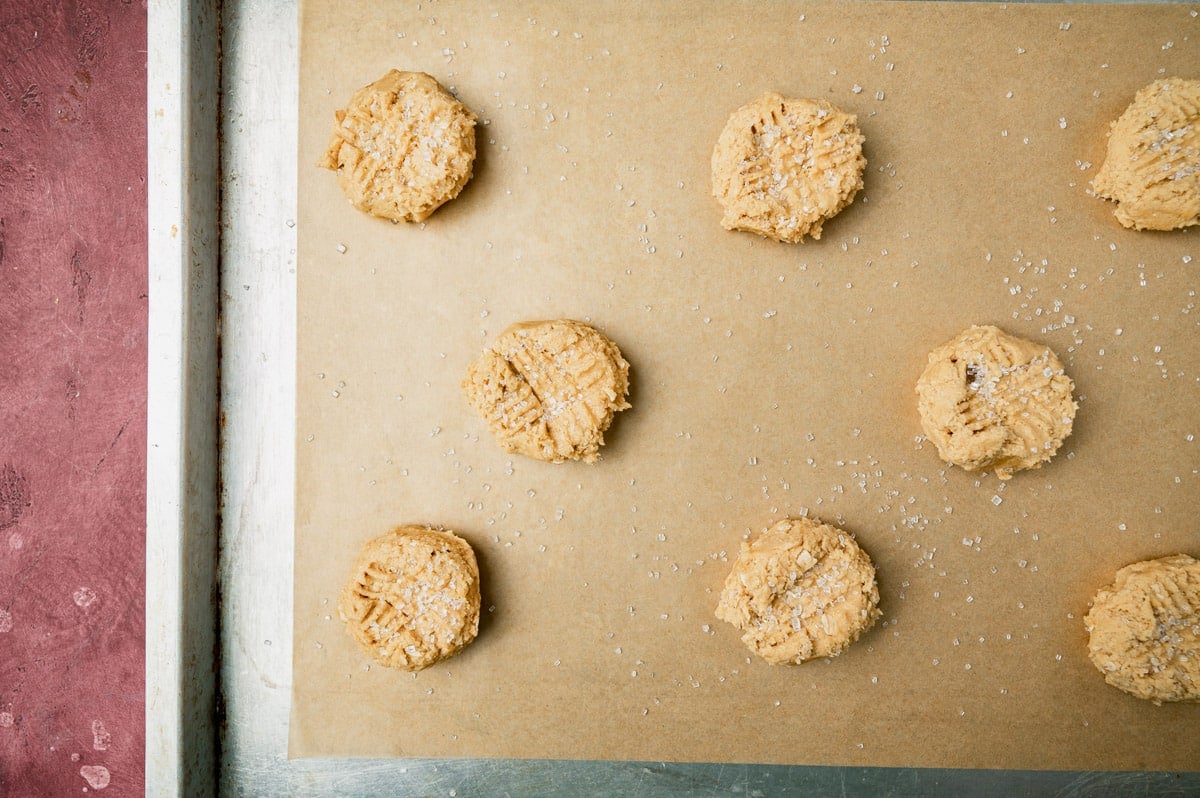 unbaked peanut butter oatmeal cookies on a baking sheet