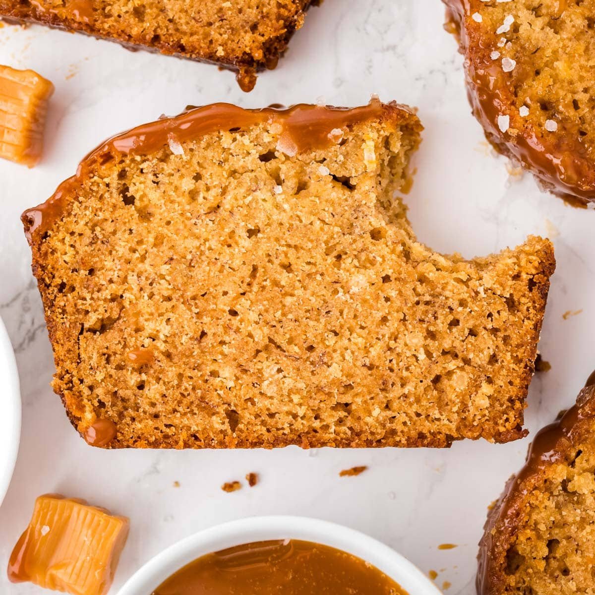 a slice of banana bread with a bite out of it on a table