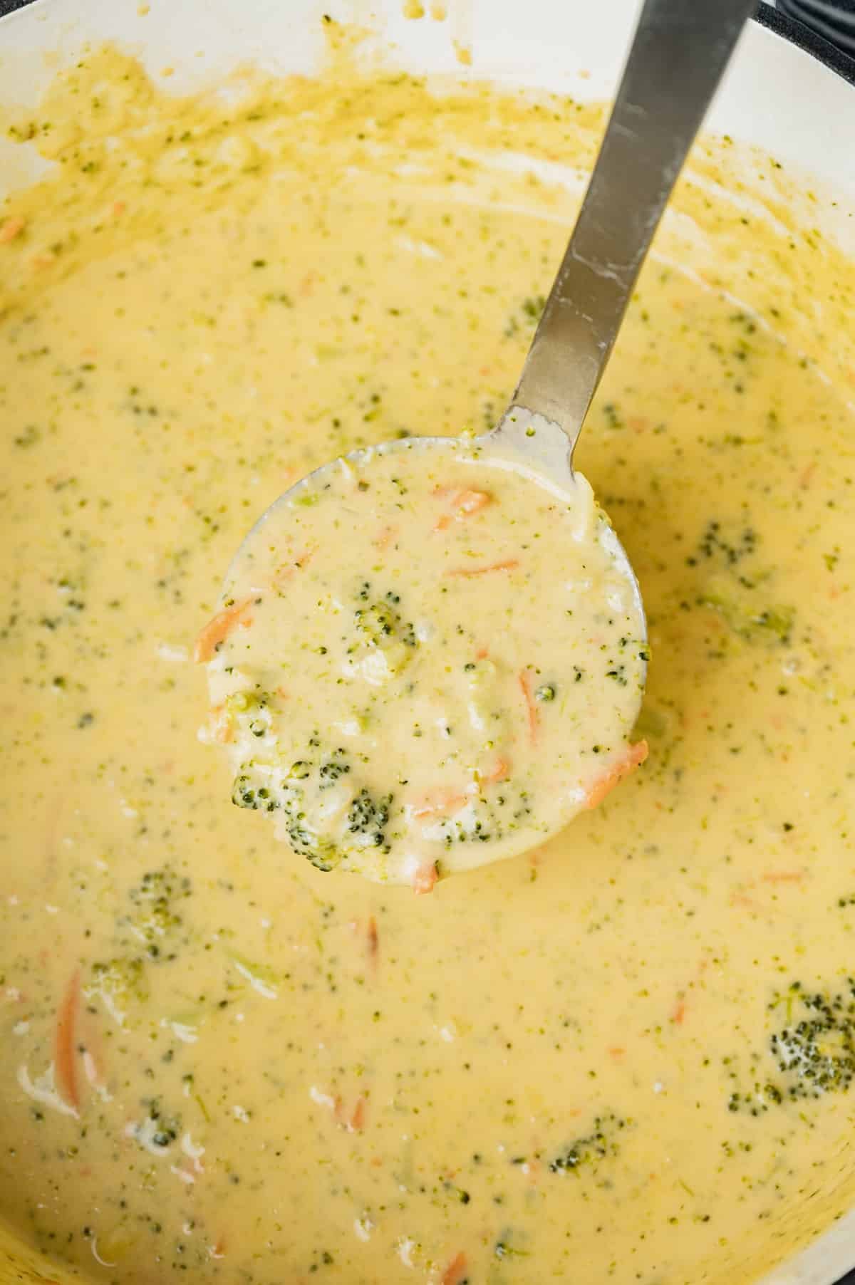 creamy broccoli cheddar soup on a ladle