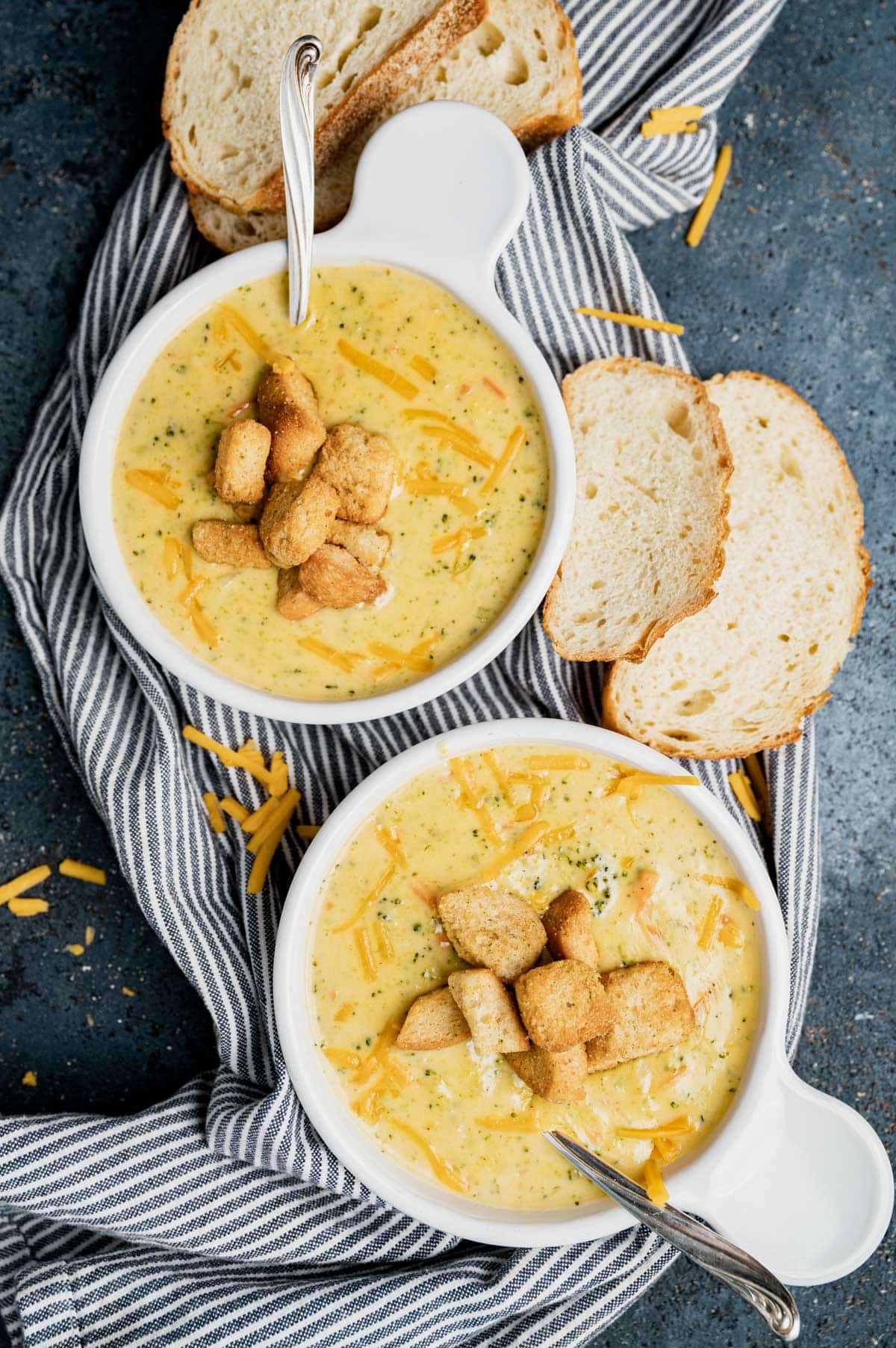 two bowls of creamy broccoli cheddar soup