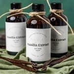 3 bottles of vanilla extract on a table