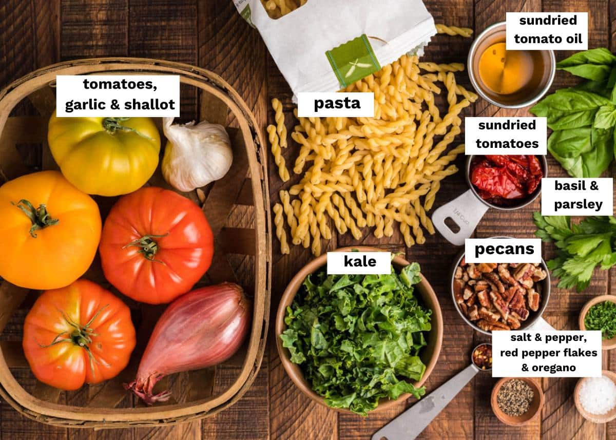 ingredients for vegetarian pecan tomato pasta on a table