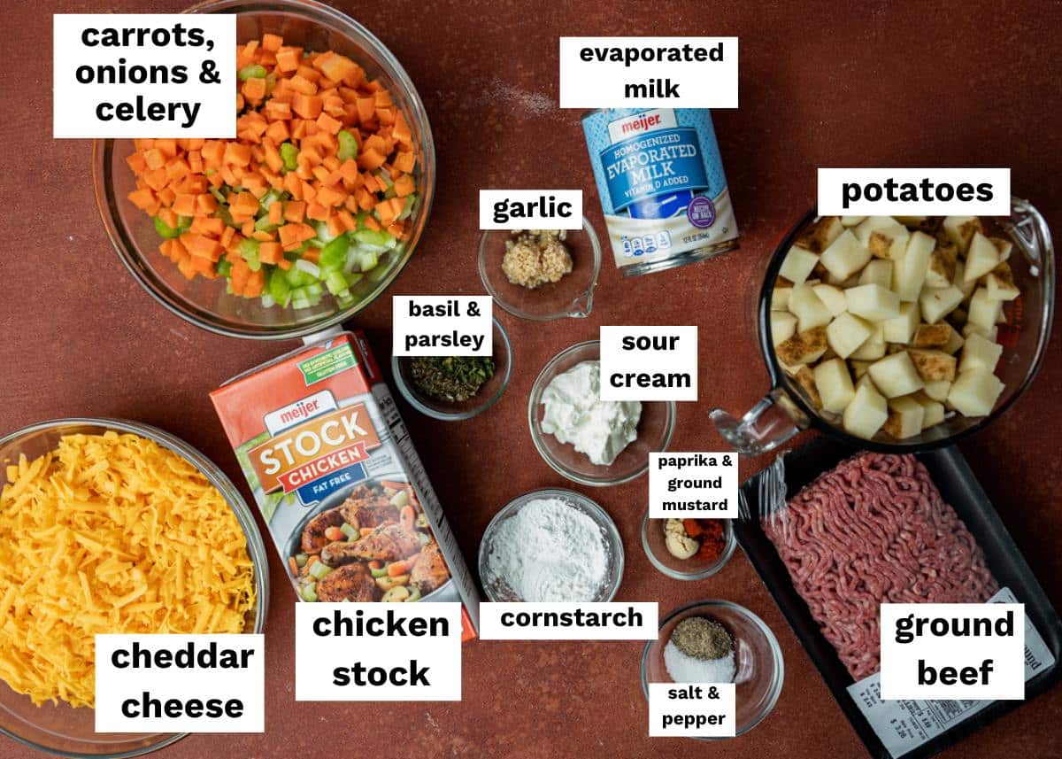 ingredients for cheeseburger soup on a table