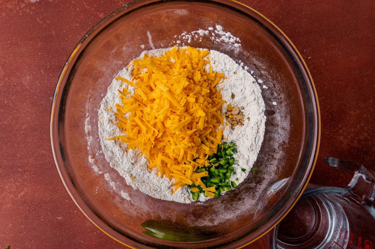 flour, cheese, garlic and jalapeño in a mixing bowl