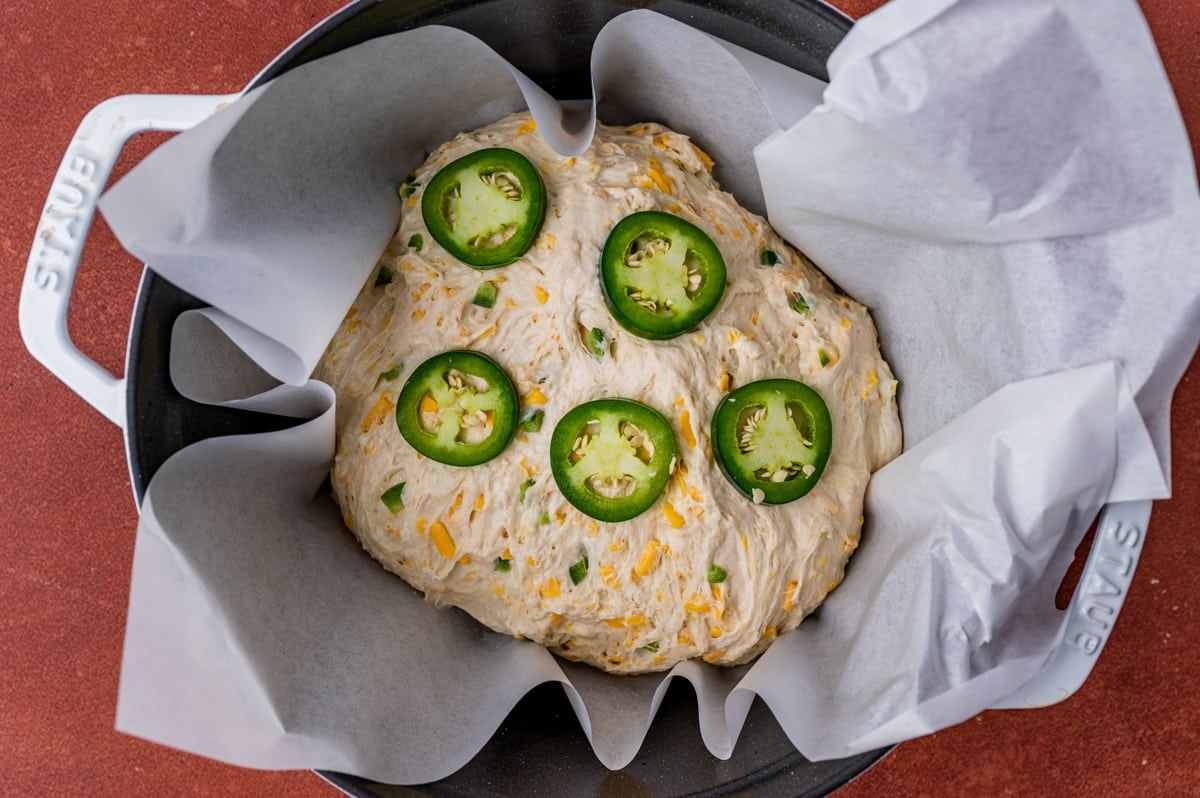 unbaked jalapeño cheese bread in a dutch oven