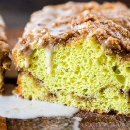 closeup of a loaf of pistachio bread with glaze