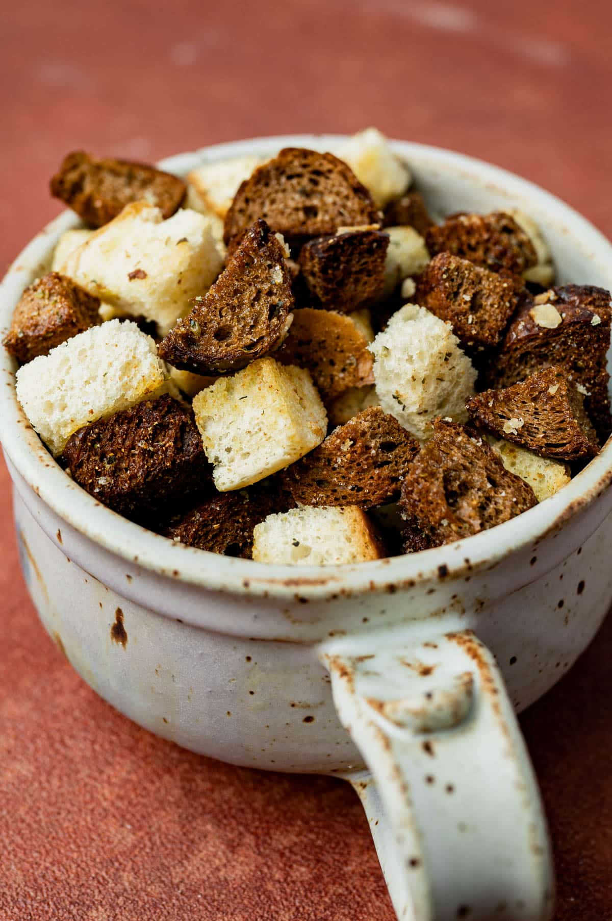 a cup of homemade croutons