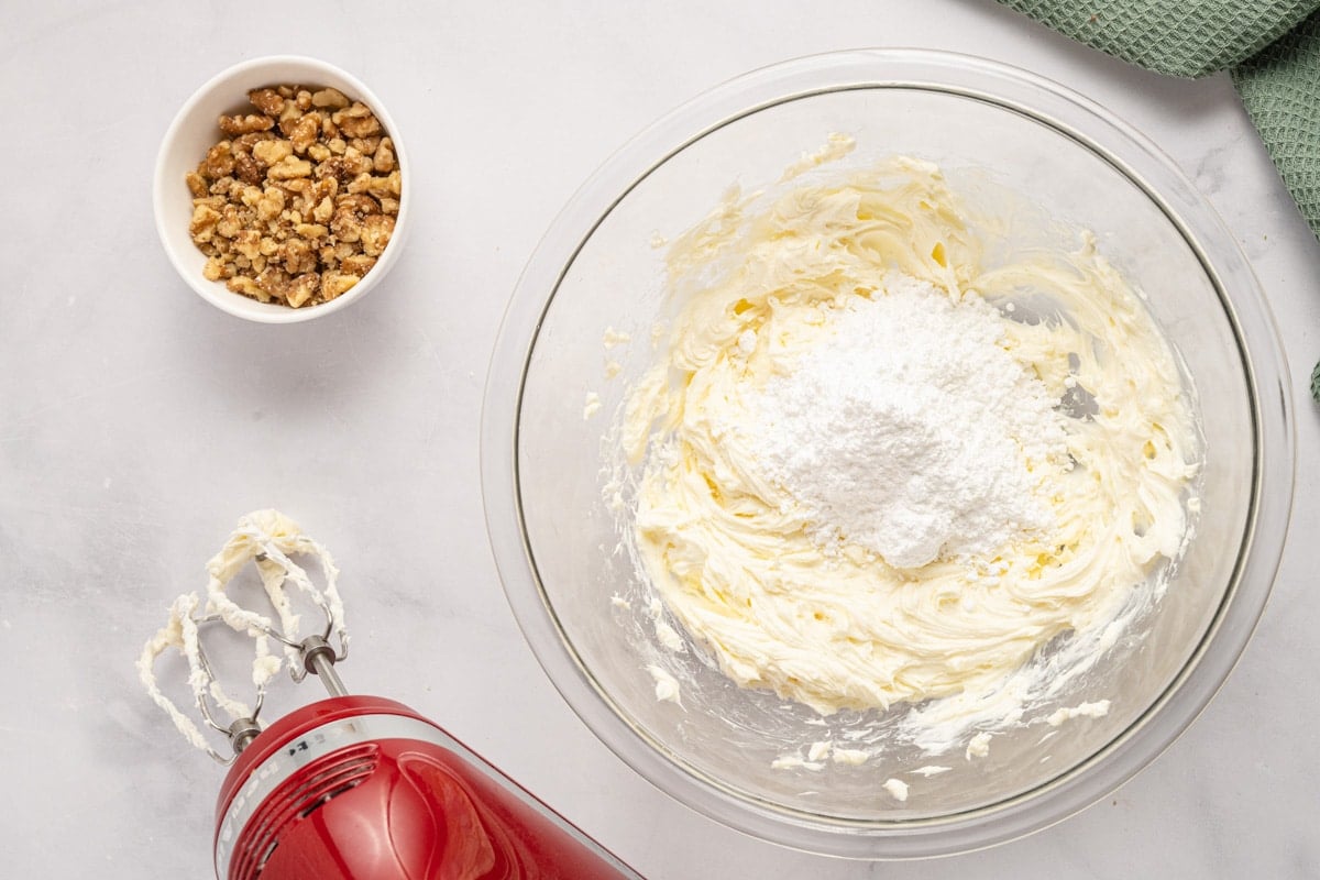 creamed butter and cream cheese with powdered sugar on top