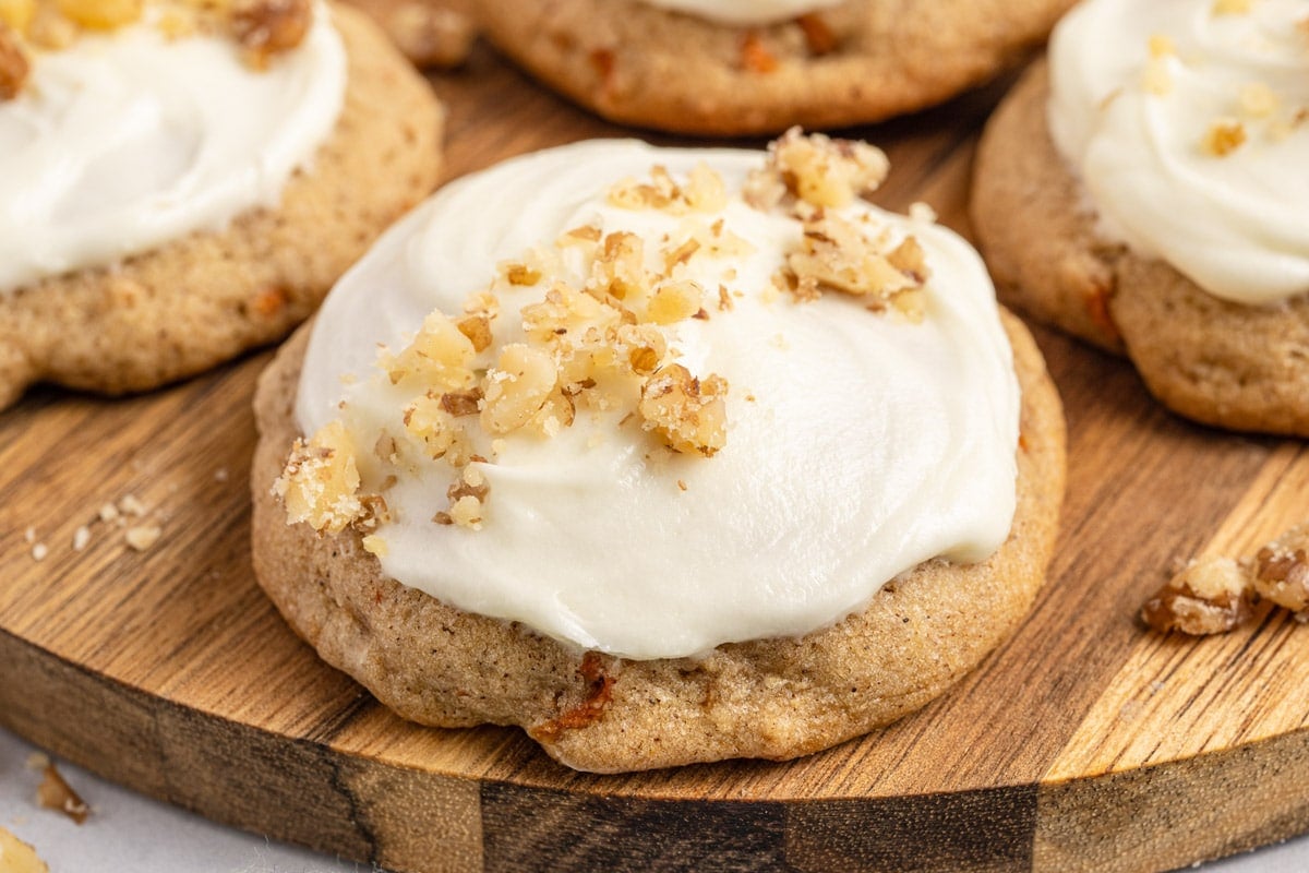 a carrot cake cookie on a wooden plate