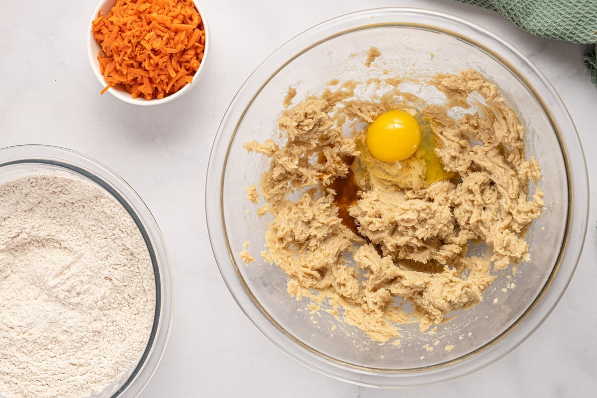 creamed butter and sugar in a bowl with an egg