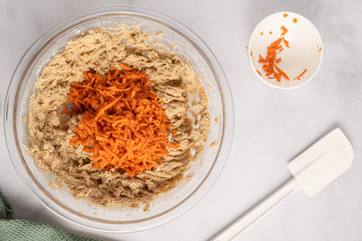 cookie dough with shredded carrots on top