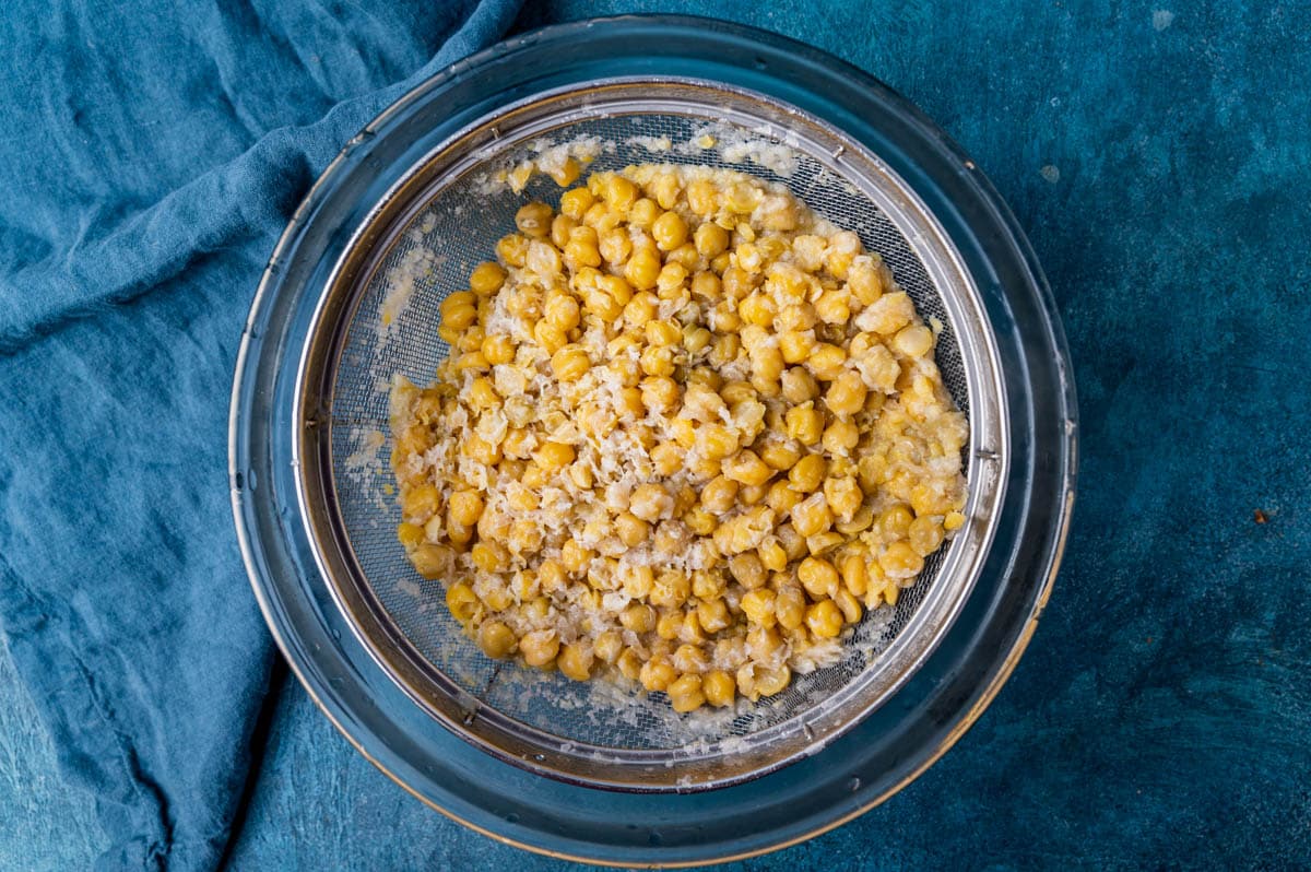 cooked chickpeas in a strainer