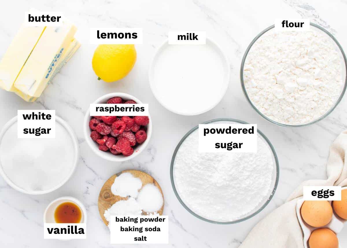 ingredients for lemon cake with raspberries on a table