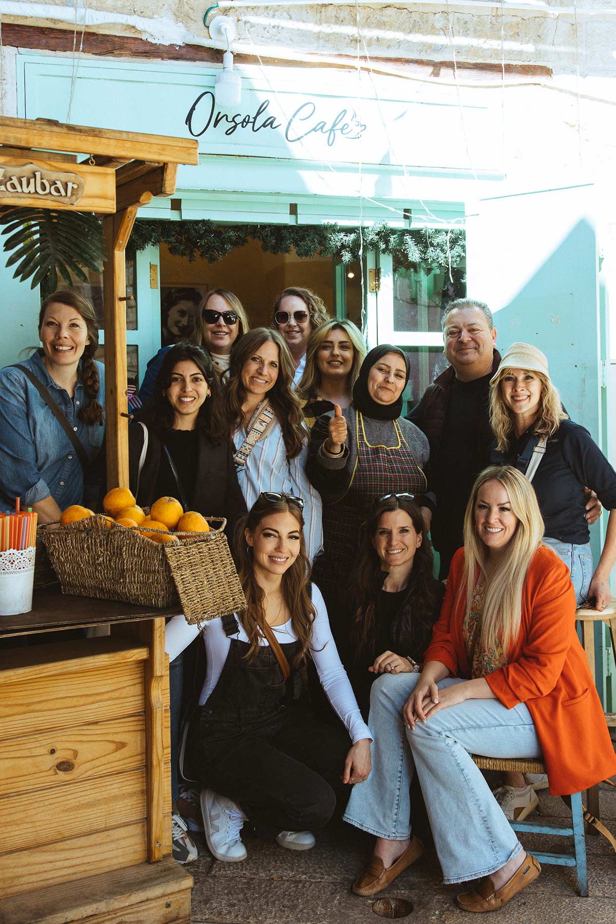 a group of people at a cafe in Nazareth