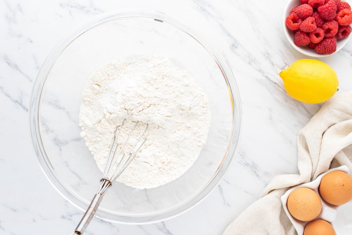 flour in a mixing bowl with a whisk