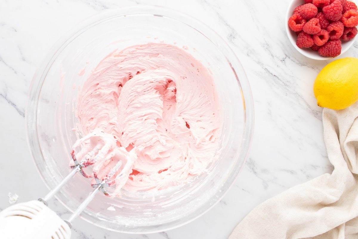 raspberry frosting in a mixing bowl