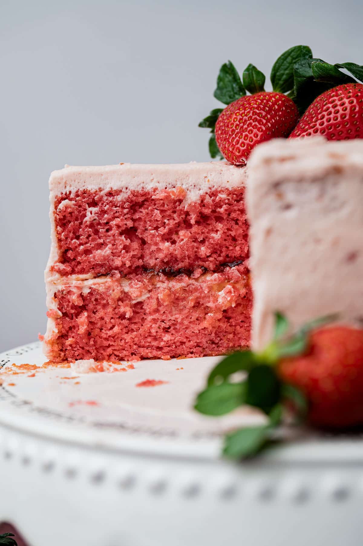 a strawberry cake with a slice cut out